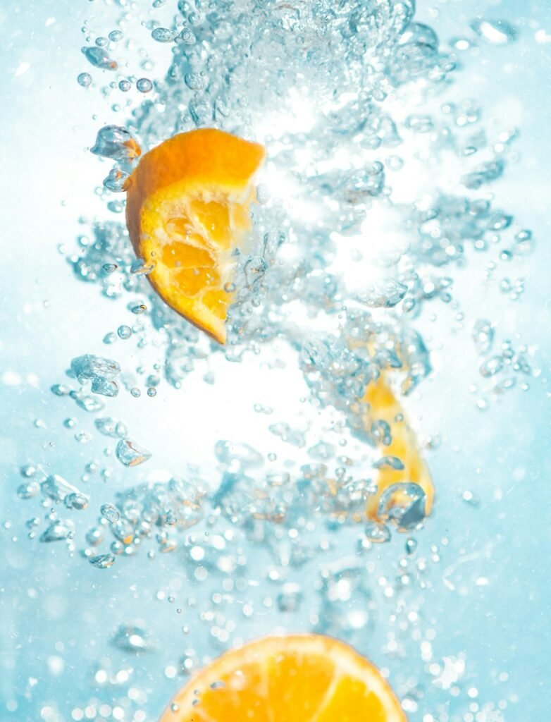 Glass of lemon water, one of the best natural remedies for tummy bloating